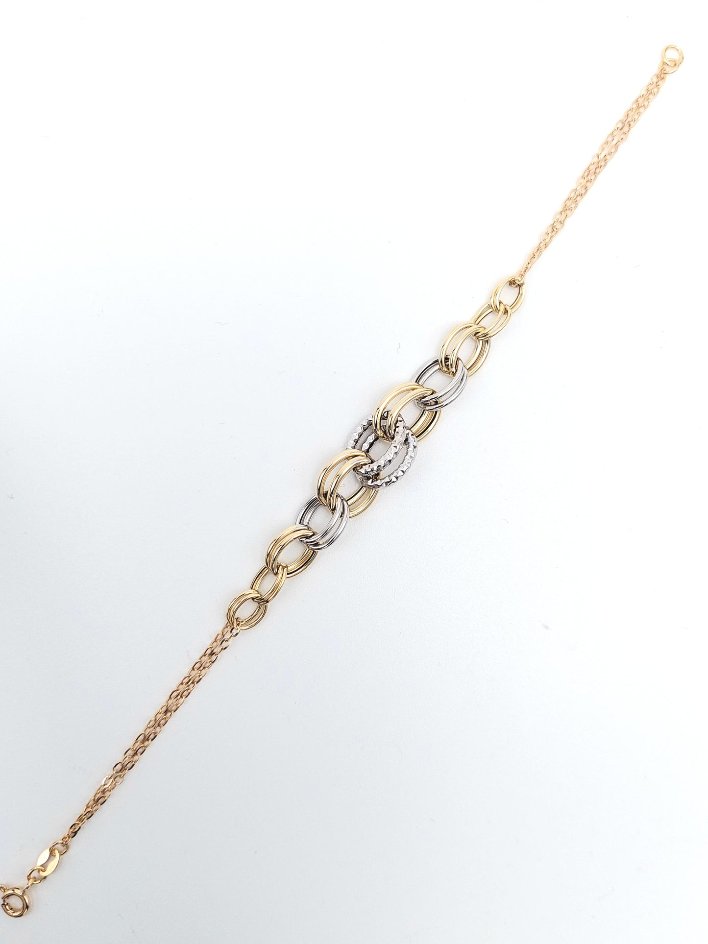 Bracciale da donna a catena in oro giallo e bianco 18 KT. BR-D-ORO037.