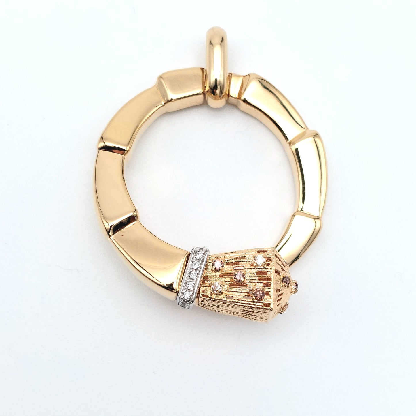 Ciondolo in oro giallo e bianco 18 kt con zirconi bianchi e champagne. CIO-ORO002.