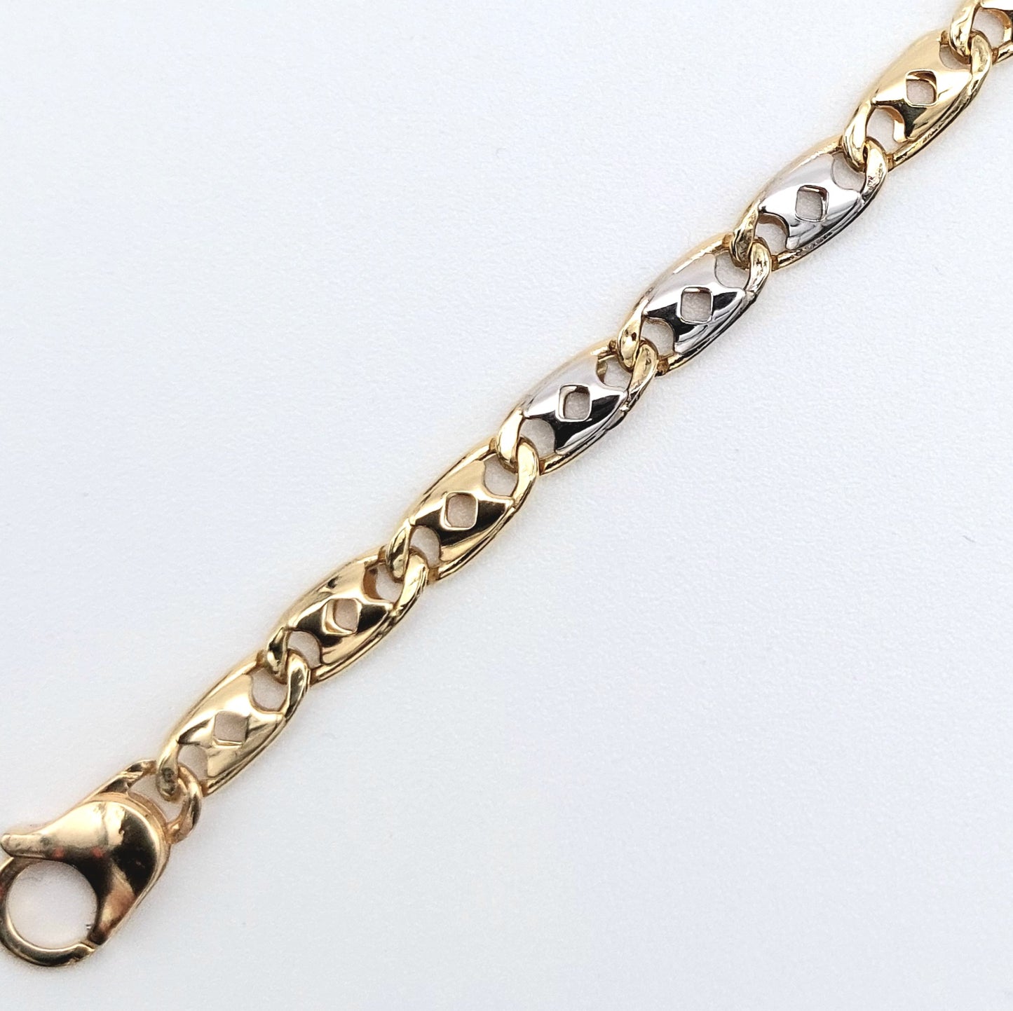 Bracciale uomo in oro giallo e bianco 18 kt. BR-U-ORO002.