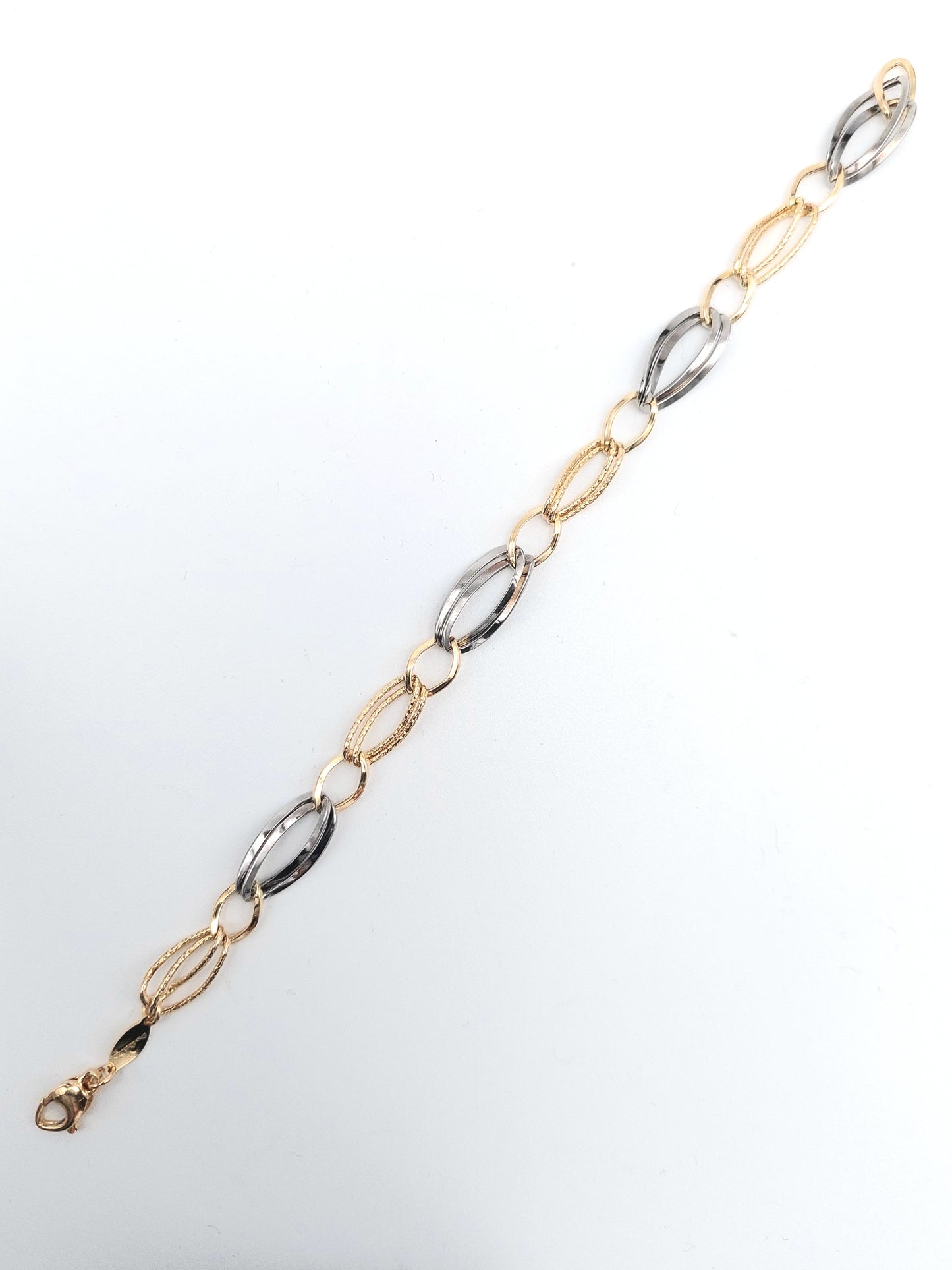 Bracciale a catena da donna in oro giallo e bianco 18 KT. BR-D-ORO057.