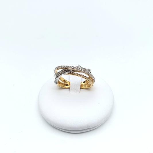 Anello in oro giallo e bianco 18 KT, con zirconi bianchi. AN-ORO026.