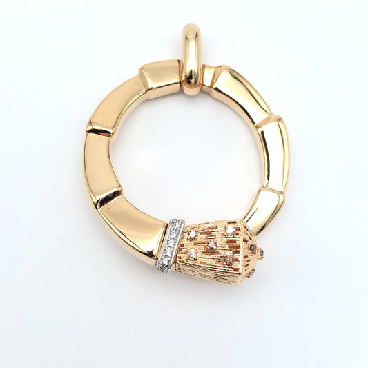 Ciondolo in oro giallo e bianco 18 kt con zirconi bianchi e champagne. CIO-ORO002.