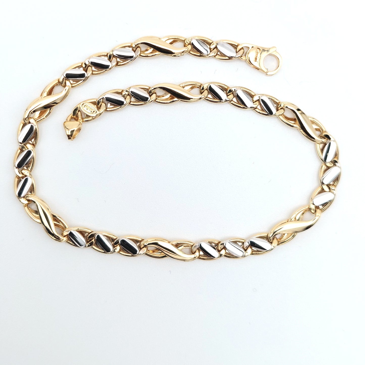 Bracciale da uomo in oro giallo e bianco. BR-U-ORO004.