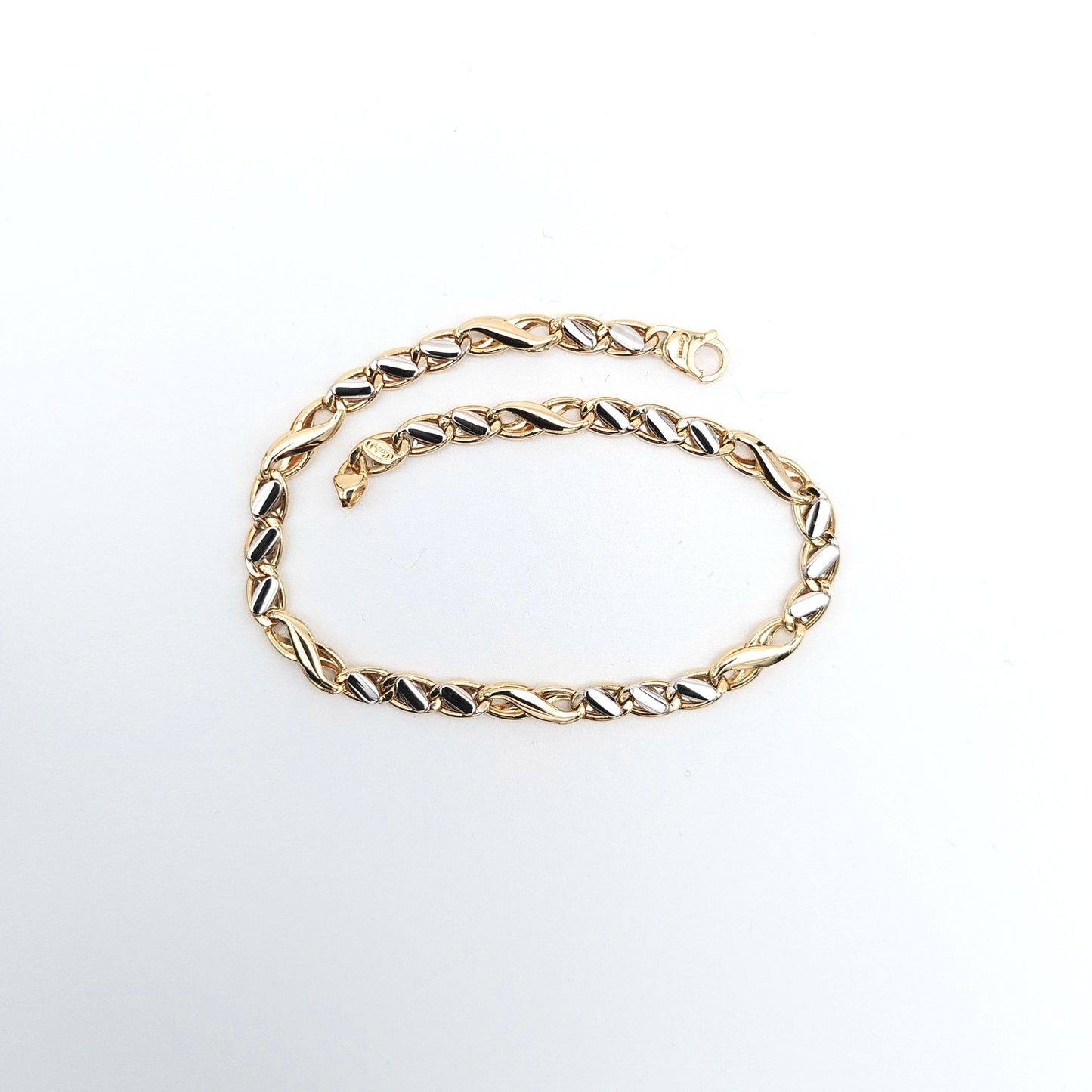 Bracciale da uomo in oro giallo e bianco. BR-U-ORO004.