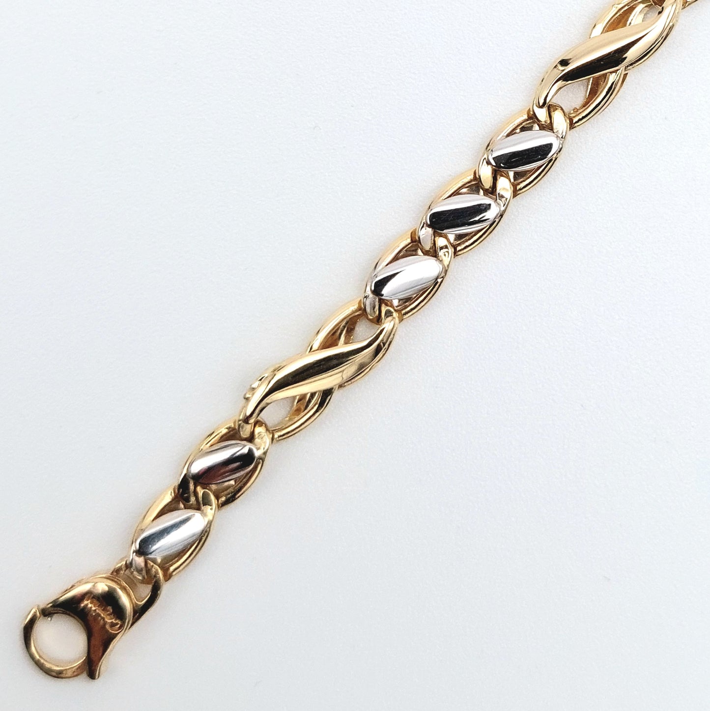 Bracciale da uomo in oro giallo e bianco. BR-U-ORO004.
